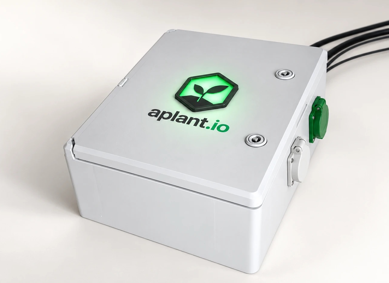 aplantio One: white control unit with a glowing green aplant.io logo on the lid and power outlets on the side